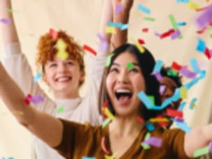 People celebrating in confetti for all seven Awin entries making the cut for the Global Performance Marketing Awards 2023