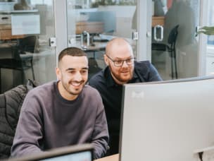 Awin employees in office, outlining a plan to protect customers’ affiliate tracking and earnings amid Google phasing out third-party cookies