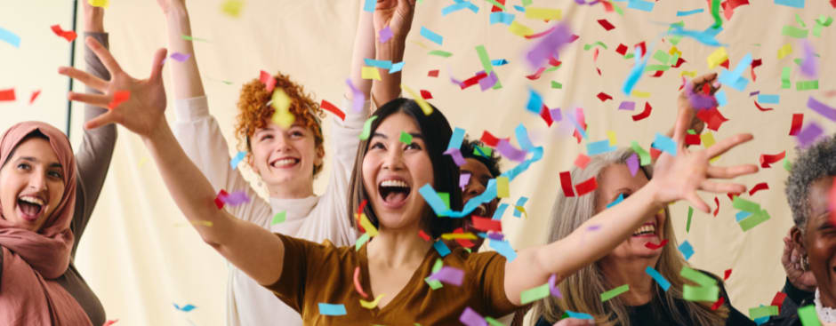 People celebrating in confetti for all seven Awin entries making the cut for the Global Performance Marketing Awards 2023