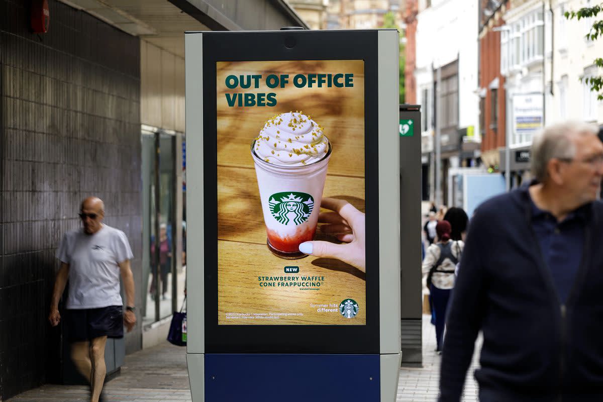 Starbucks advertising on a high street advertising screen